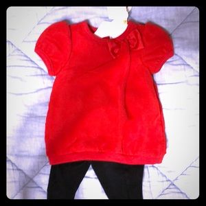 Red bow top with black pants